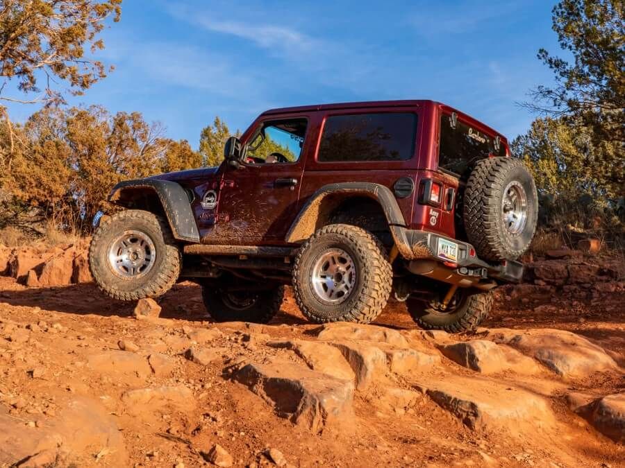 Driving a Jeep Rubicon over dusty sandstone rocks is one of the best things to do during a sedona itinerary