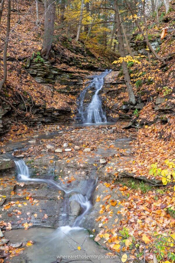 Small waterfall at Letchworth State Park with fall leaves