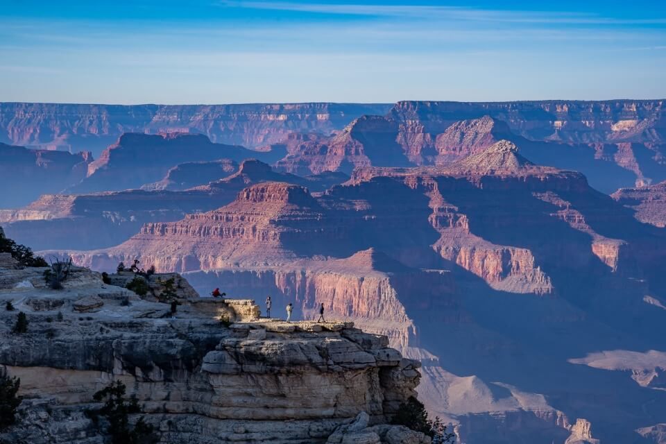 people standing at an overlook in Grand Canyon National Park
