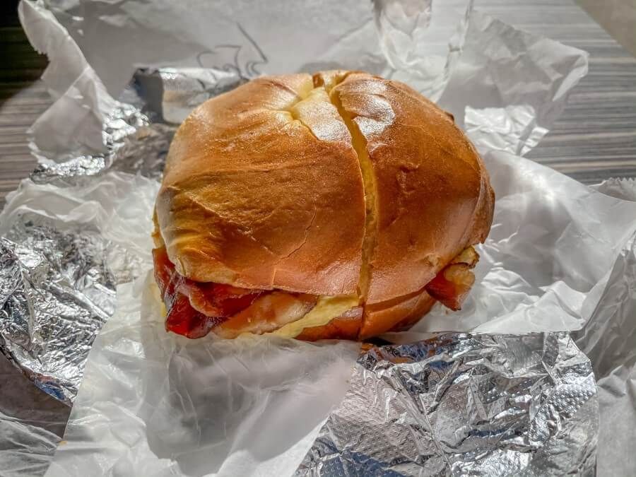 A plain bagel with bacon, egg and cheese toppings