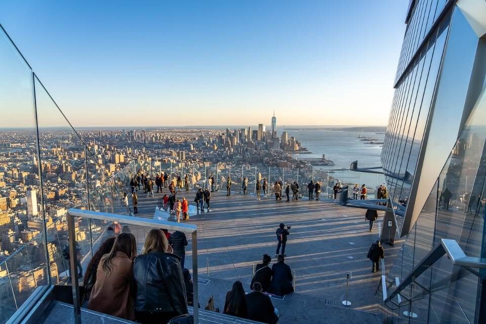 Visitors enjoying their time at a New York City observation deck in Midtown