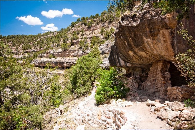 Ledge trail with cliff dwellings and canyon walls