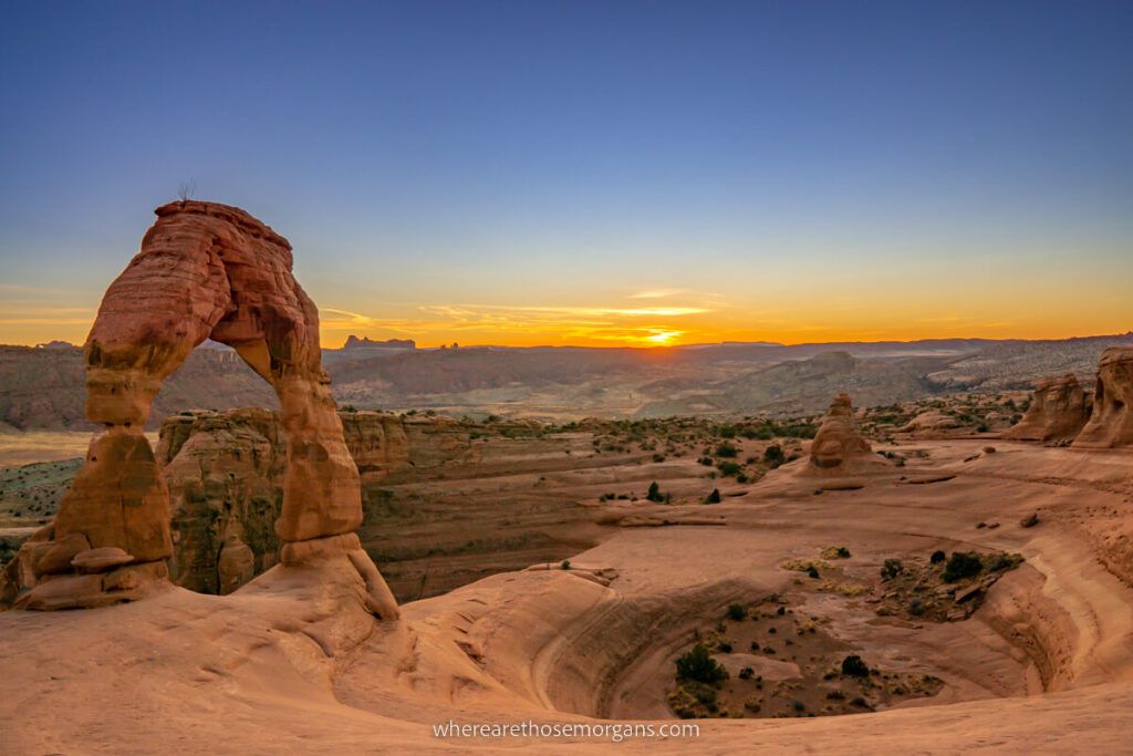Delicate Arch in Arches National Park at sunset is one of the best places to visit in Utah
