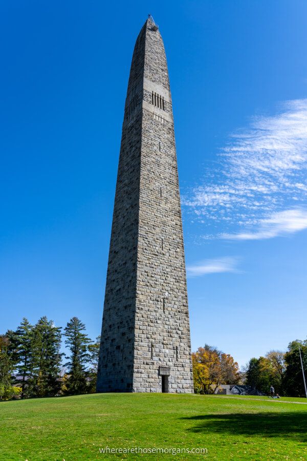 Bennington Battle Monument tall brick needle shaped tower on a grassy hill