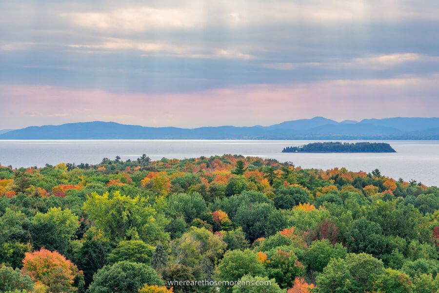 View of Lake Champlain on the Vermont New York border with sun beams and green trees stunning place to visit on vacation
