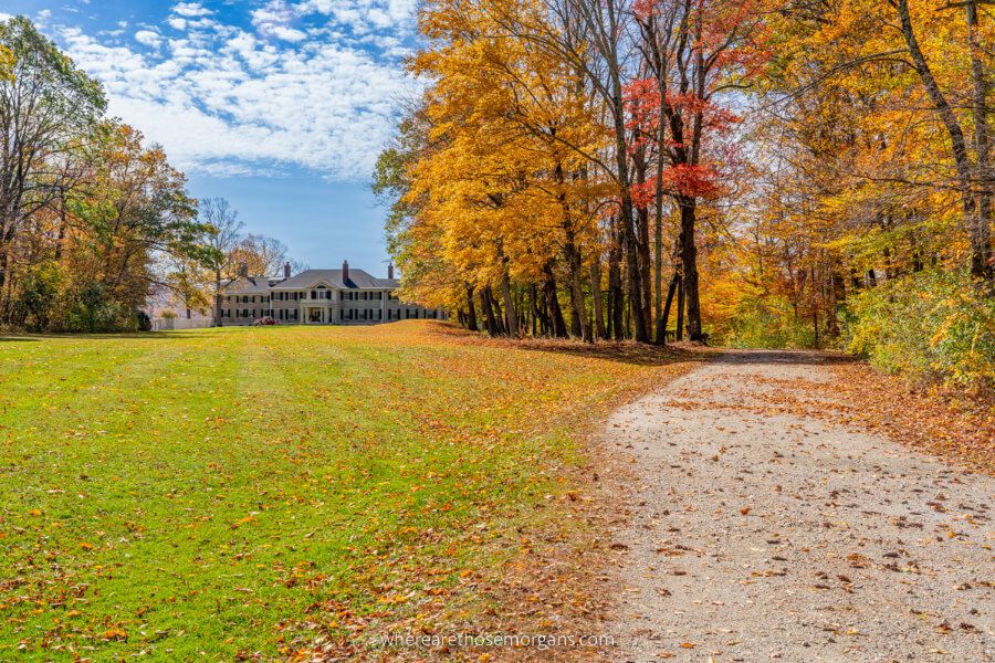 Hildene Lincoln family residence with green grass colorful leaves on trees and road near Manchester is one of the top places to visit in Vermont