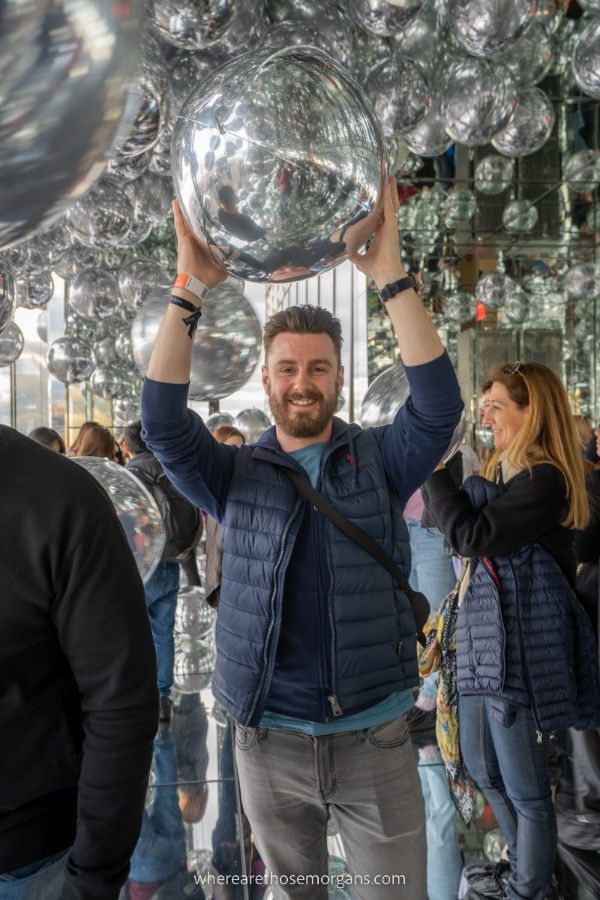 Man smiling and holding a large silver balloon in Affinity