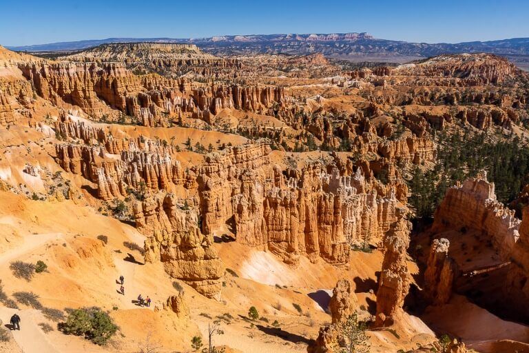 Stunning viewpoint into Bryce Canyon National Park with hikers in the trails