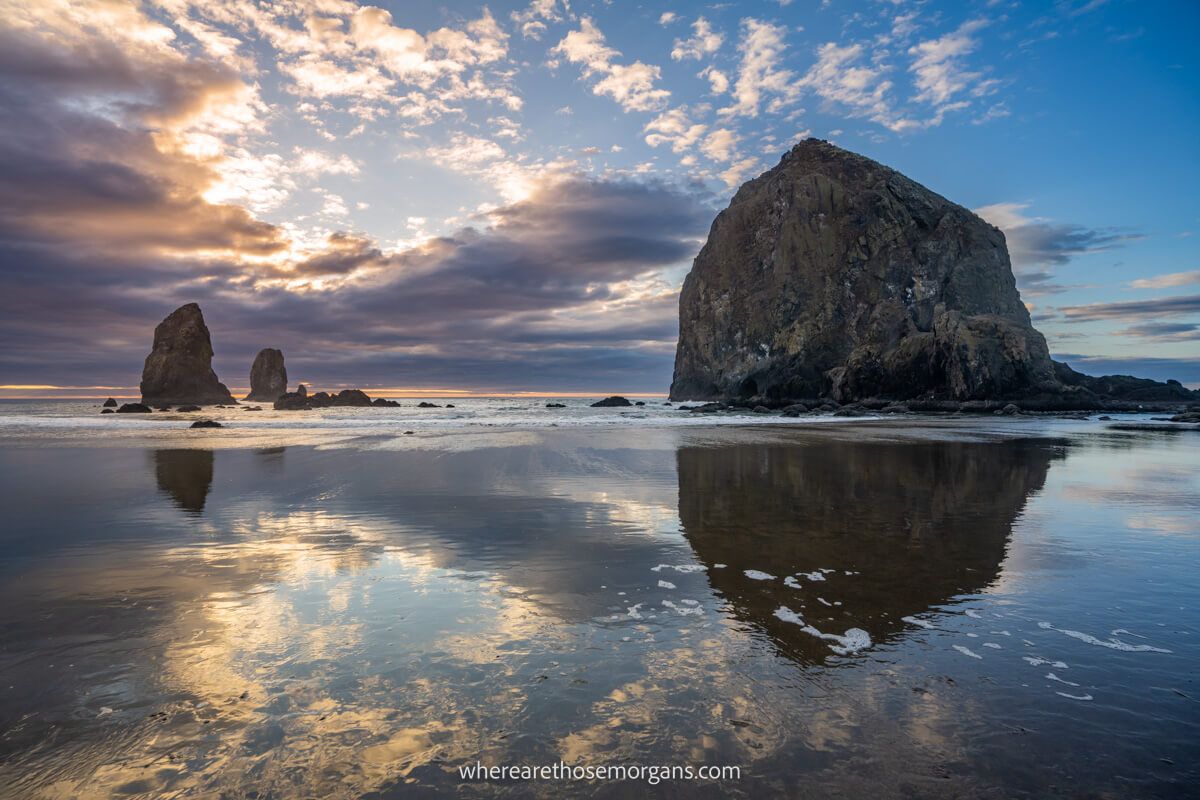 Cannon Beach stack with reflections in shallow water on beach Oregon Coast wonderful place to visit in the US