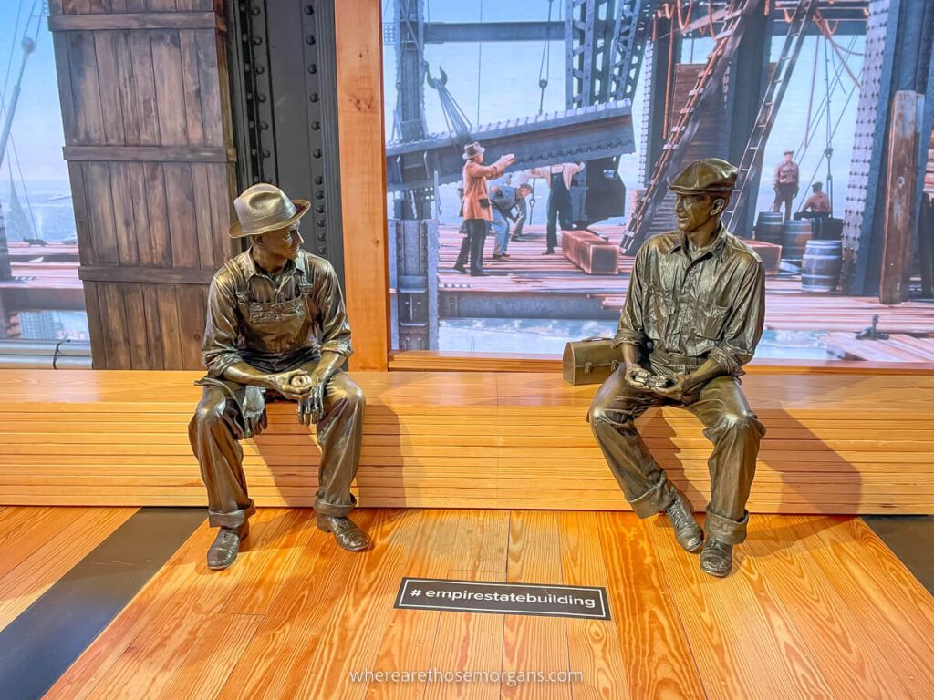 Bronze statues of construction workers at a NYC observation deck exhibit