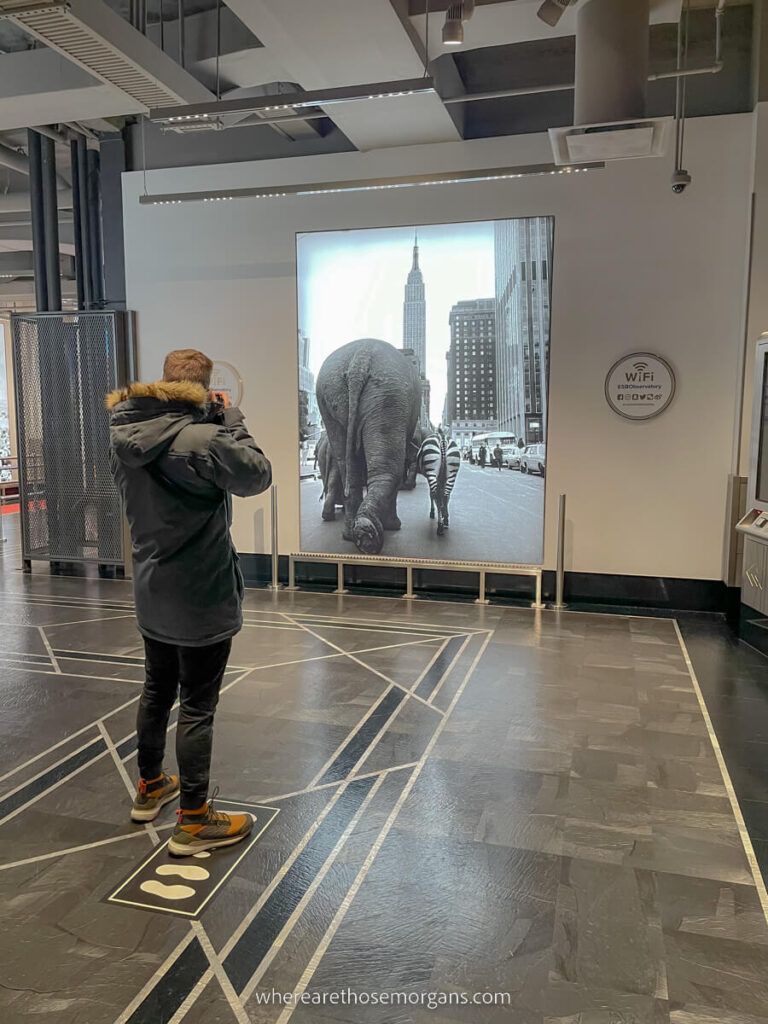 Man taking a photo of an iconic black and white photograph