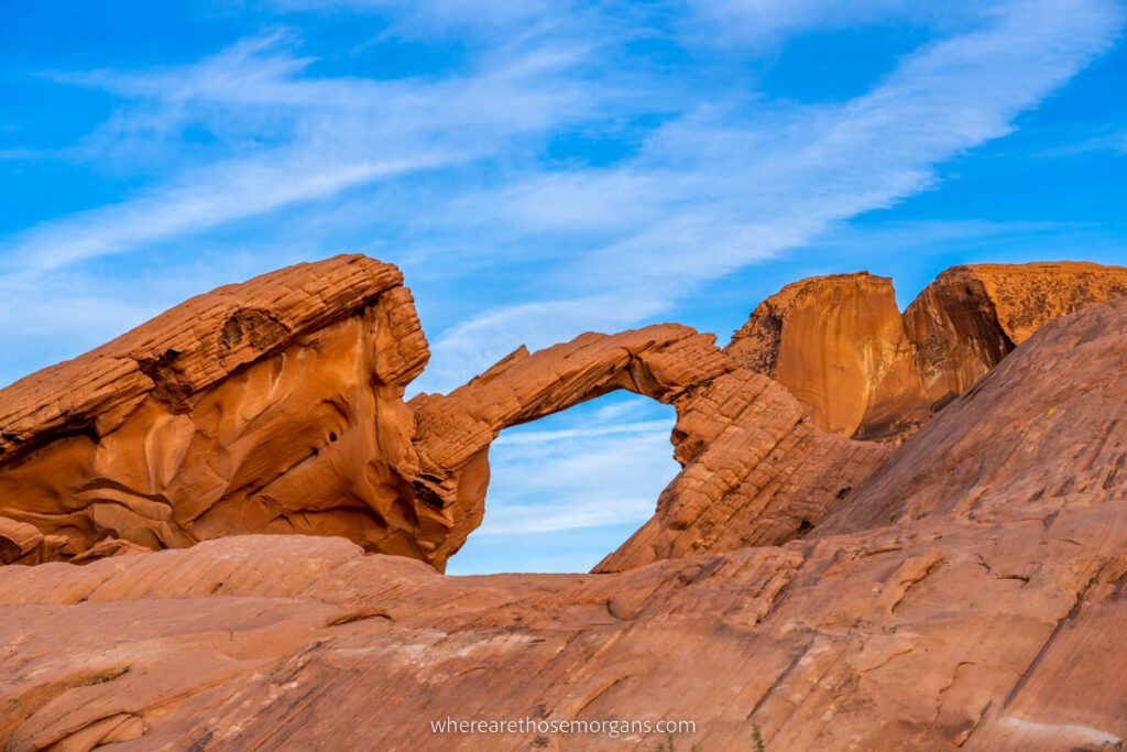 Arch Rock red sandstone arch formation against a blue sky in Nevada