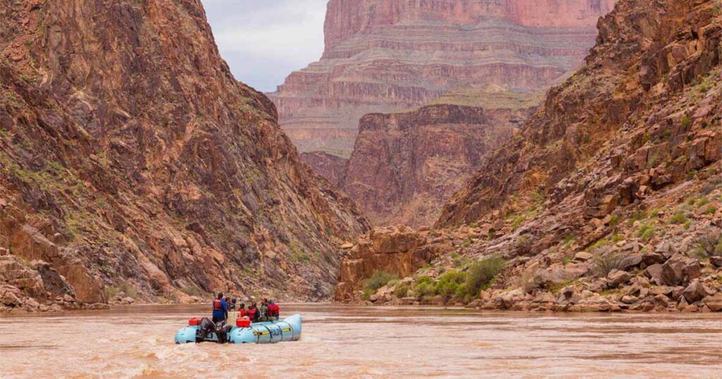 Rafting at Grand Canyon West Rim towering walls either side of Colorado River