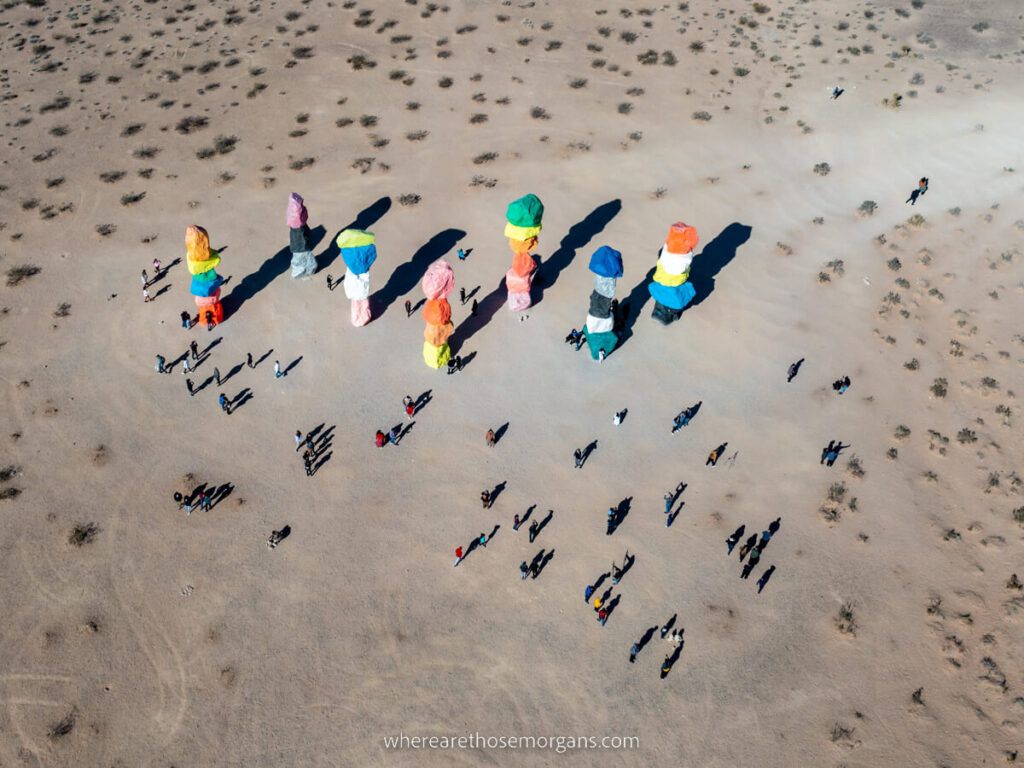 Seven Magic Mountains near Las Vegas drone photo from above with people walking around the installation