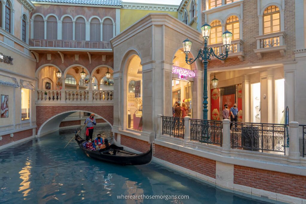 Gondola ride inside the Venetian hotel in Las Vegas is one of the most popular things for couples and families to do near the facade mock up canal side shops and streets of venice