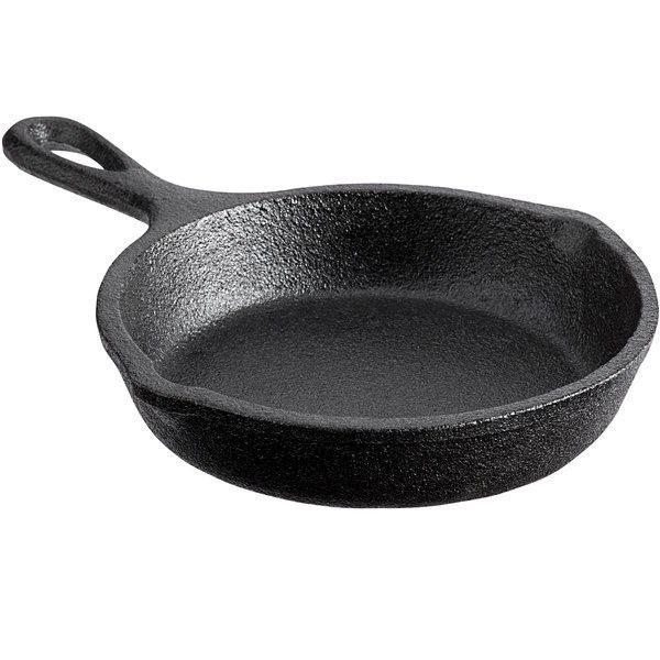 Large black cast iron skillet for camping