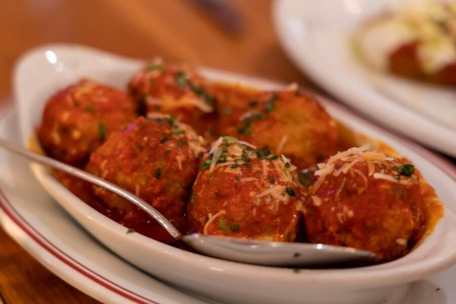 Six veal meatballs on a plate from a Secret Food Tour Las Vegas