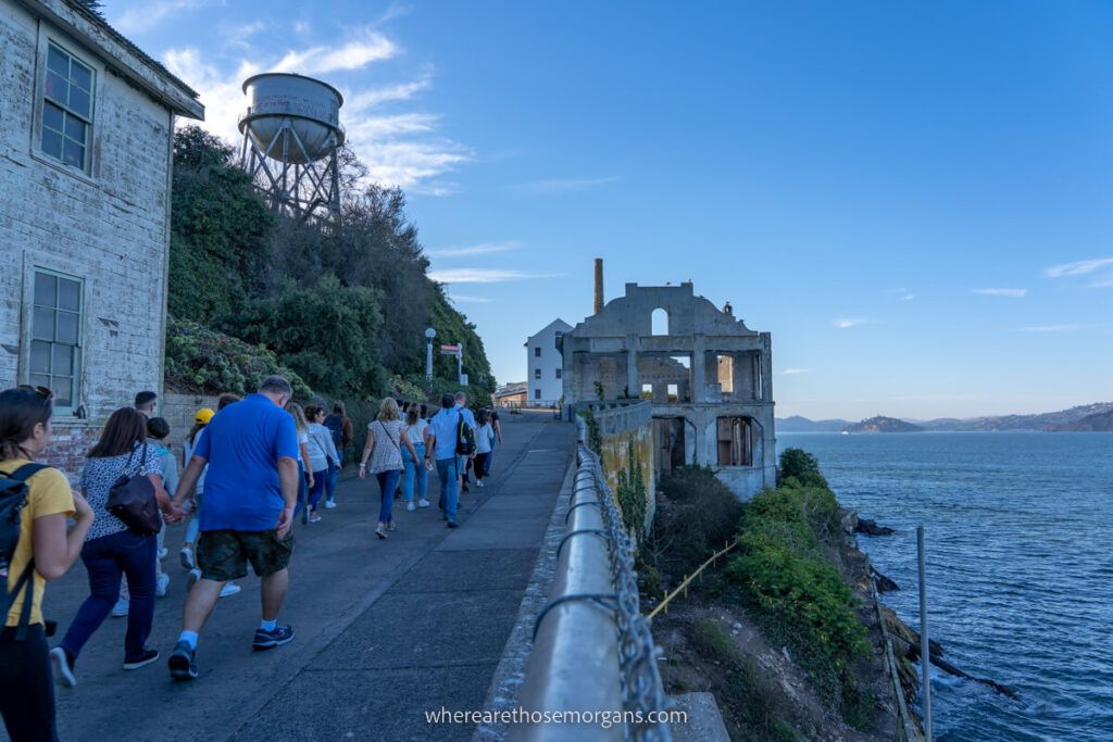 People walking up a ramp during a guided tour of Alcatraz at night