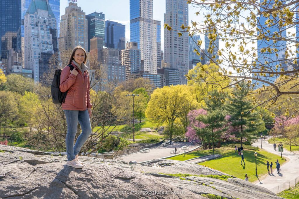Woman wearing jeans and a light coat in Central Park on a Spring visit to New York City in April