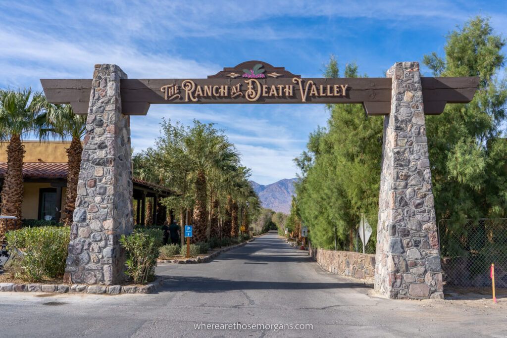 The Ranch arch sign with stone pillars and wooden board