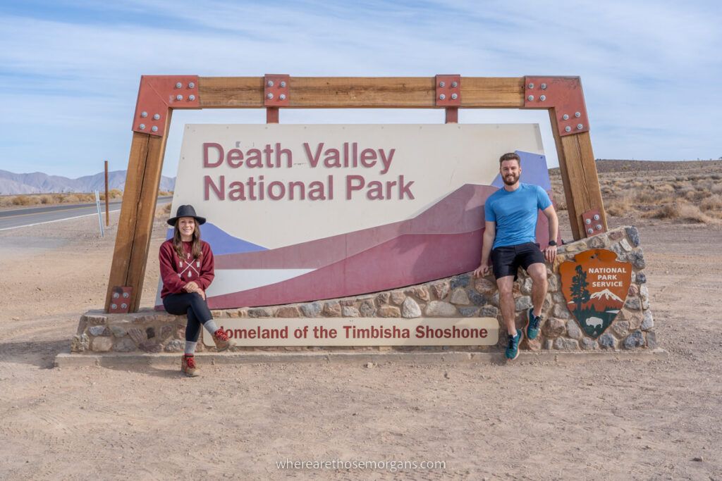 Mark and Kristen from Where Are Those Morgans sat with the Death Valley national park sign