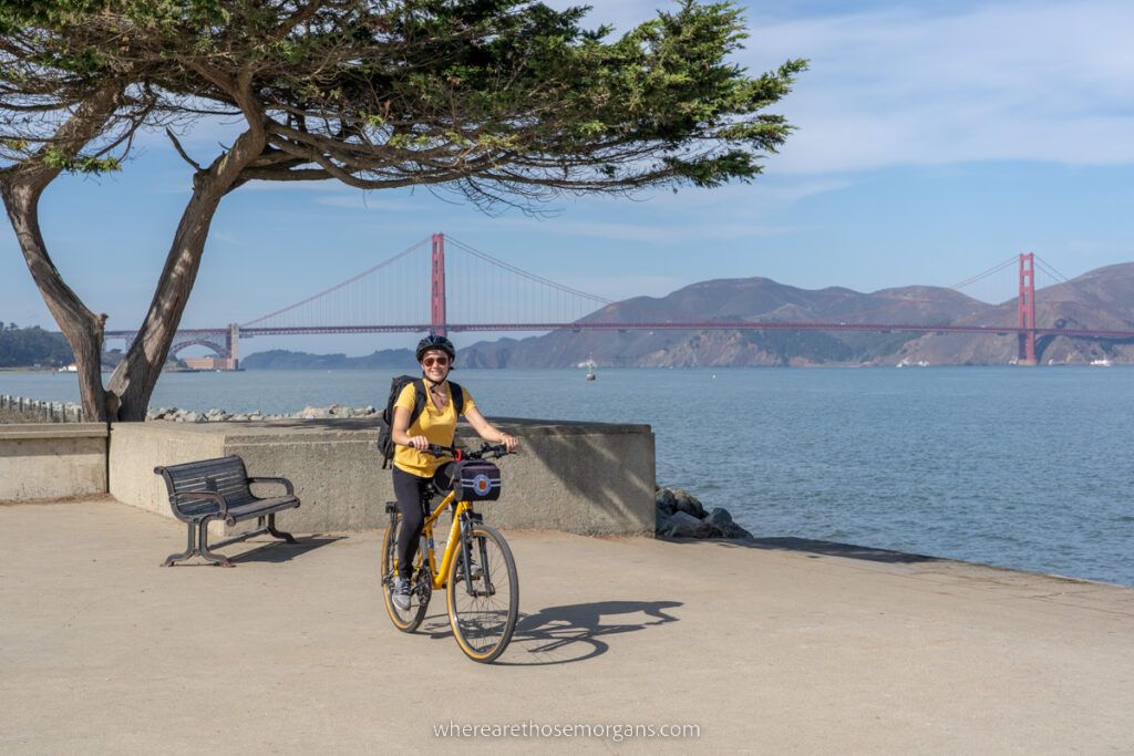 Woman riding a Bay City Bike to the Golden Gate Bridge