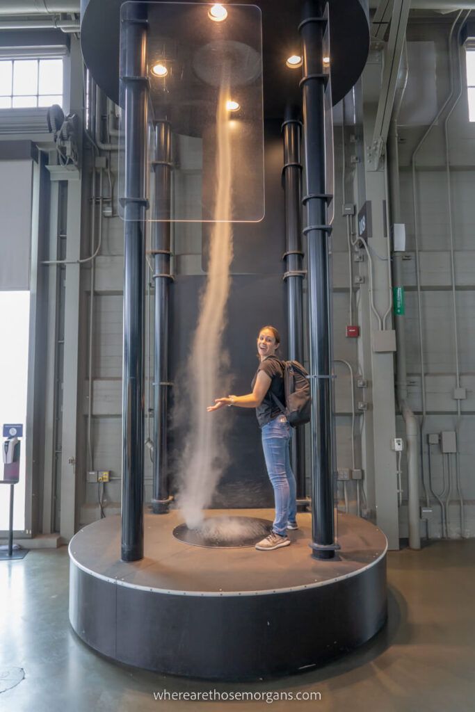 Woman playing with a tornado at the Exploratorium in San Francisco California
