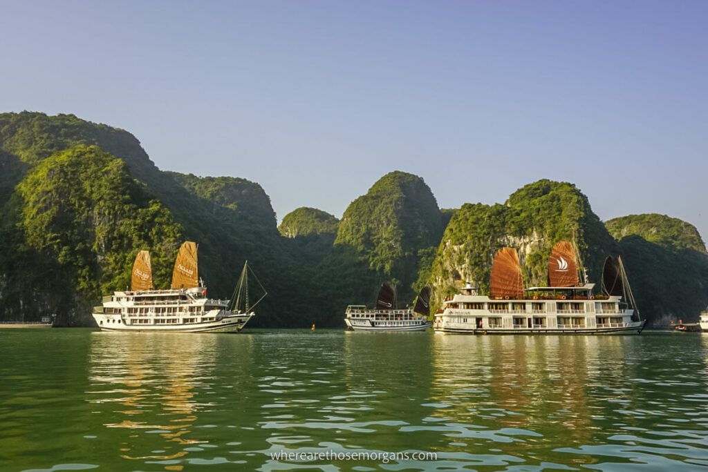 Two junk boats with red sails in Halong Bay