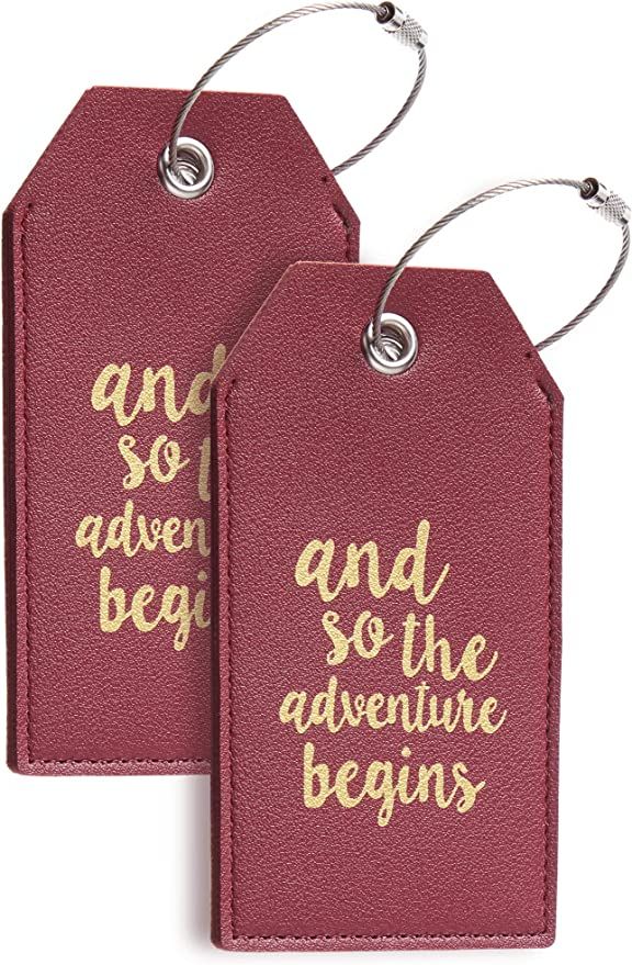 Red luggage tags with saying 'and so the adventure begins'