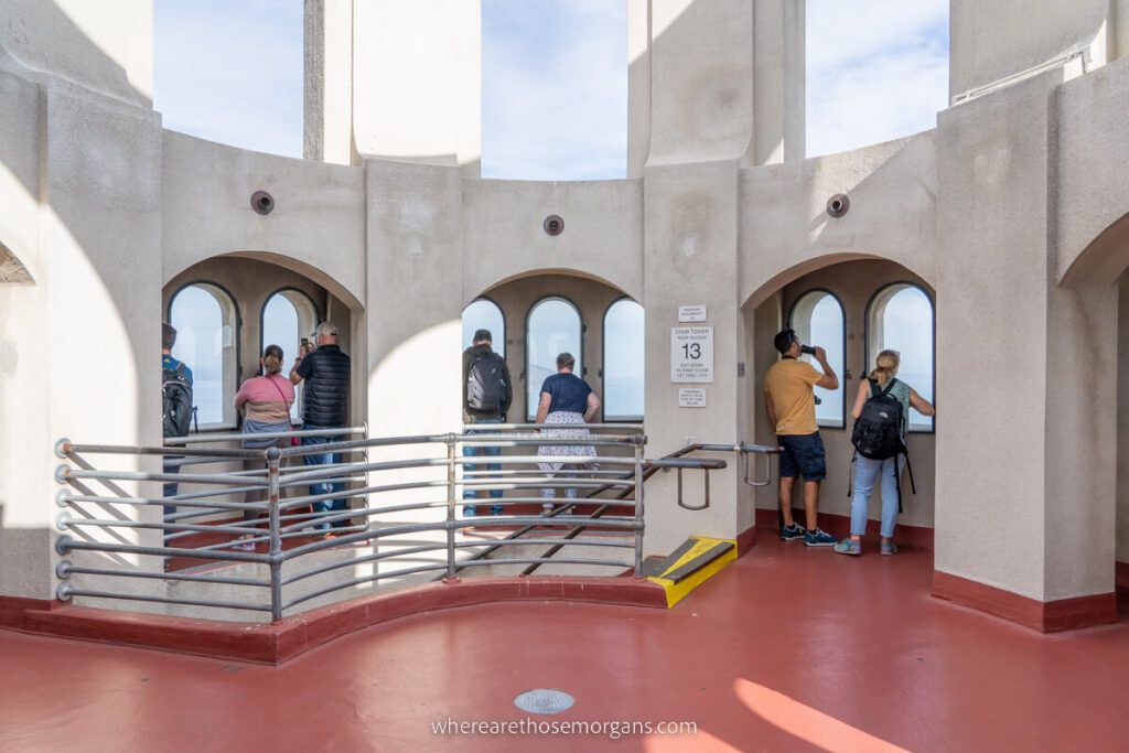 Visitors looking out the top of Coit Tower
