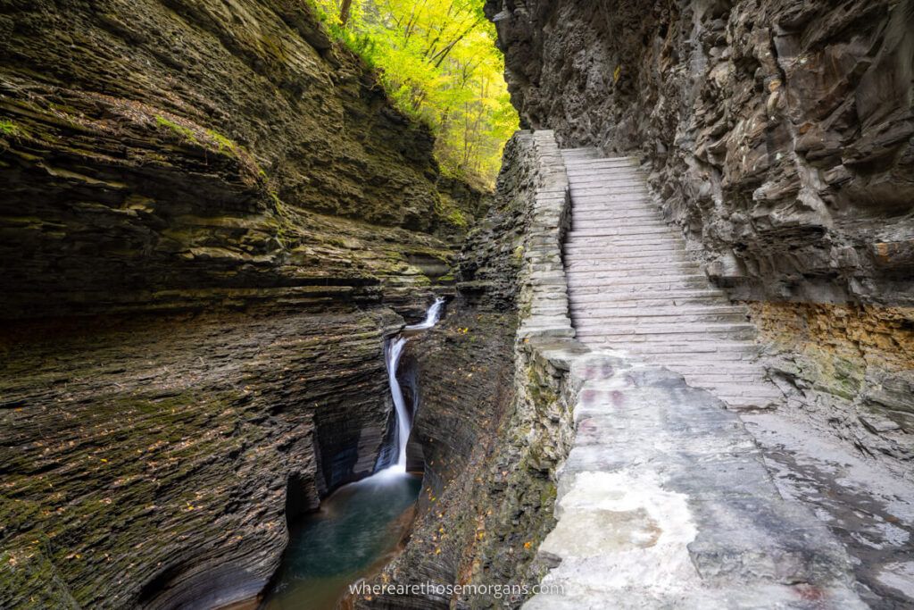 Spiral Gorge stunning stone stairs and thin waterfall in Watkins Glen State Park