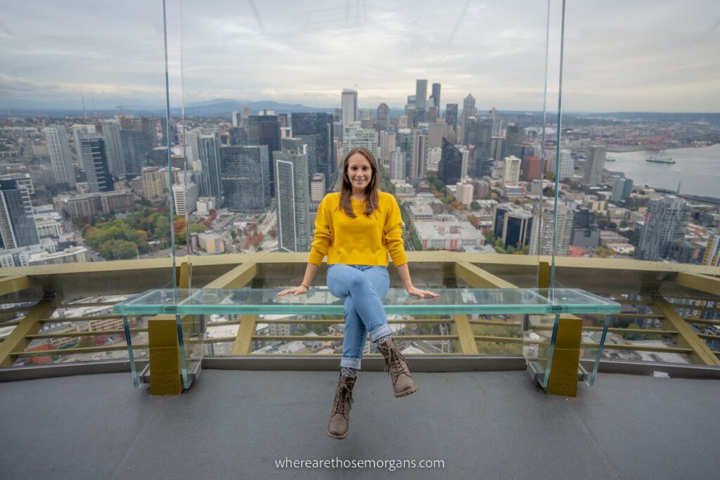 Woman sitting on a bench at the Seattle Space Needle