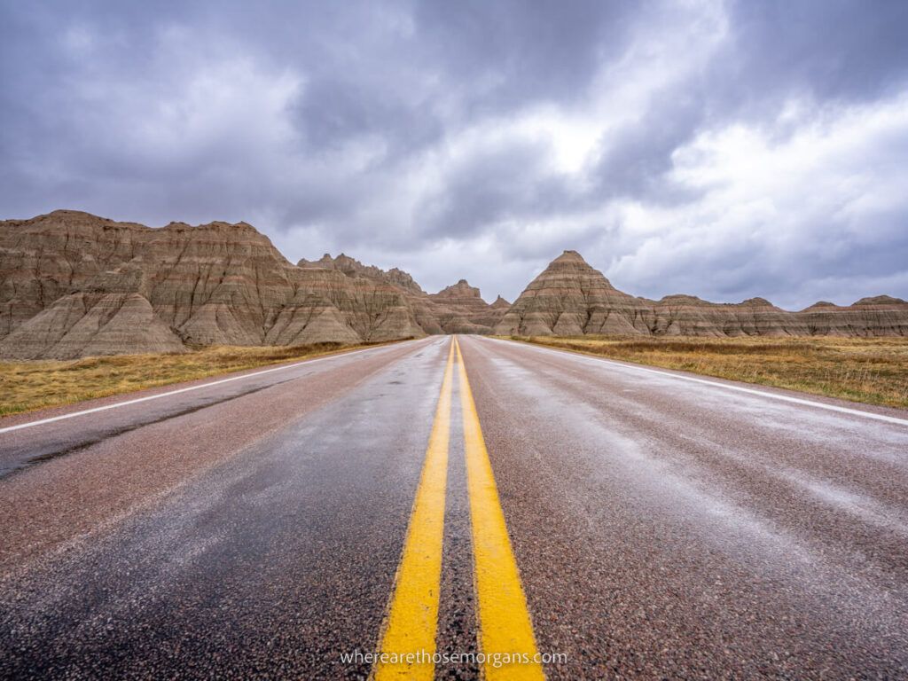 Badlands national park loop road cutting through a unique landscape on a cloudy day in south dakota