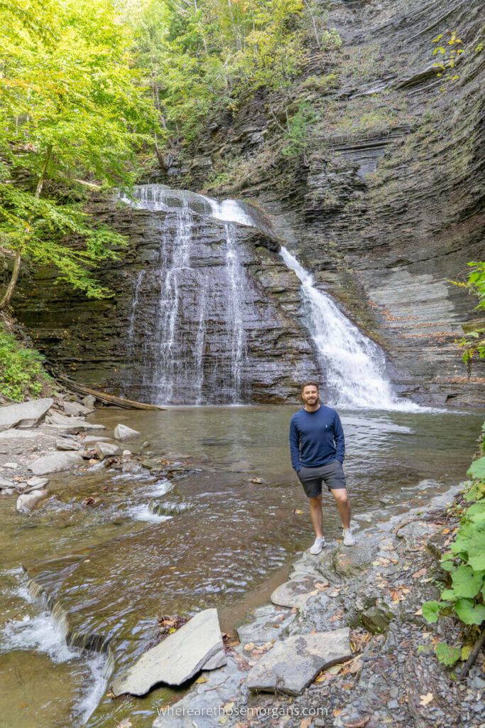 Man standing by Grimes Glen Waterfall