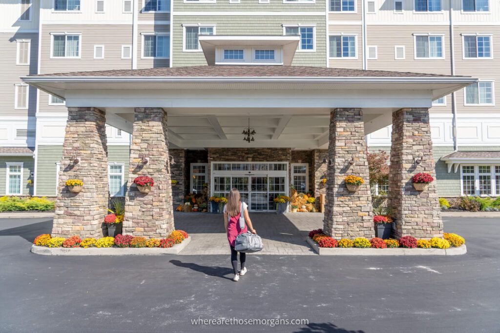 Person walking into the entrance of the Watkins Glen Harbor Hotel