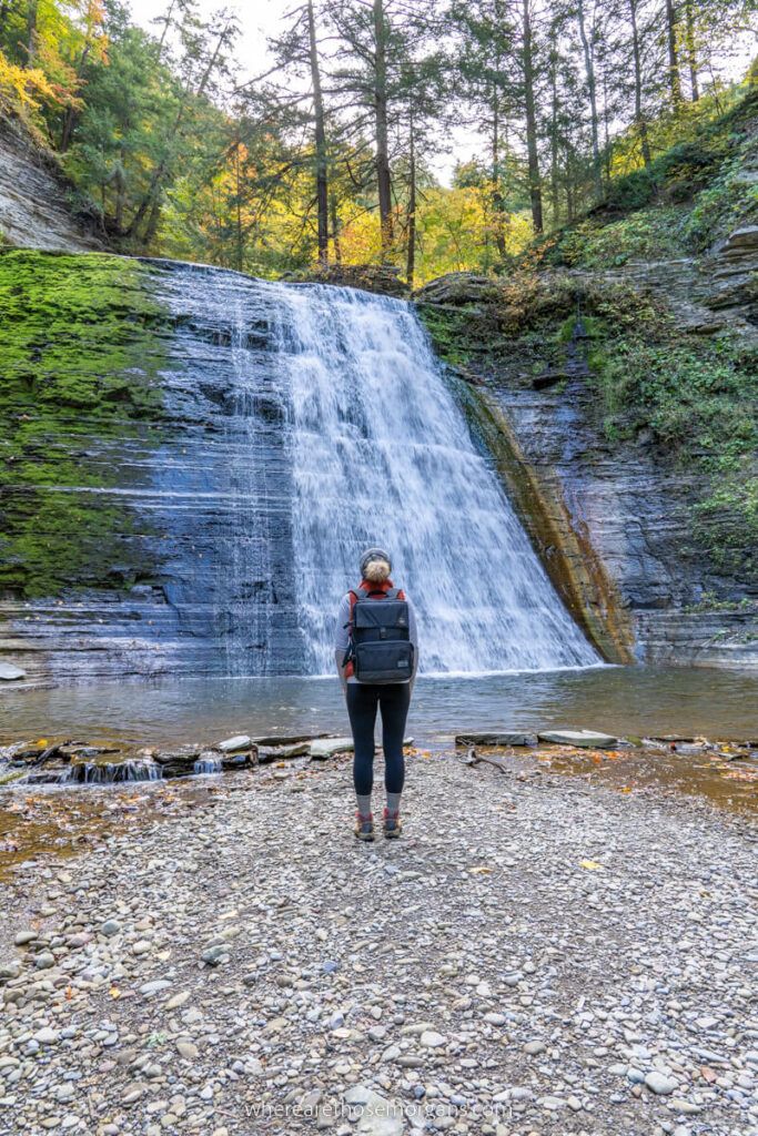 Woman standing in front of Lower Falls at Stony Brook State Park