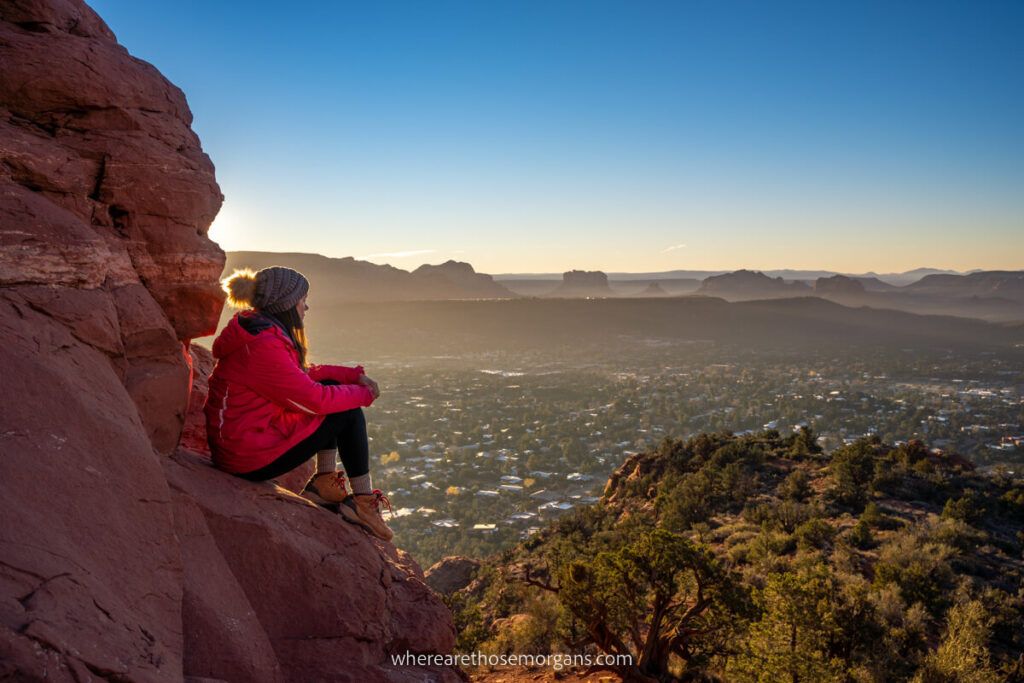 Woman looking out over Sedona during sunrise
