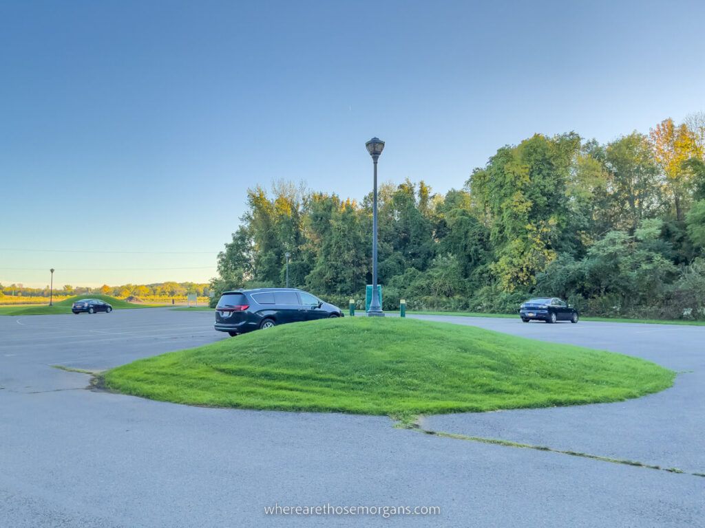 Main parking lot with a few cars at Chimney Bluffs State Park