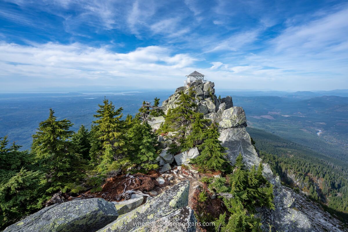 Wide angle photo of Mt Pilchuck Lookout Tower from nearby boulders