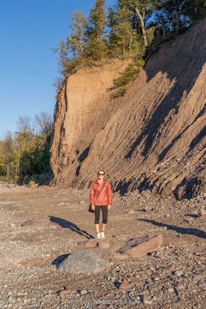 Woman standing on the shore of Lake Ontario near Chimney Bluffs State Park