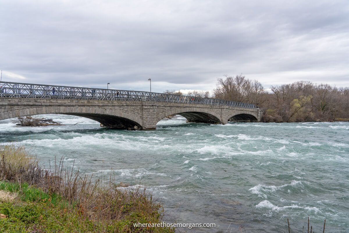 Pedestrian bridge and American rapids view from a hiking trail