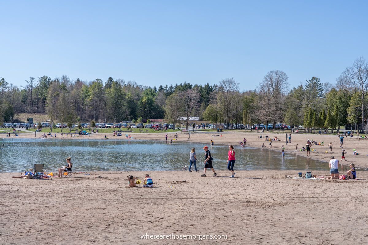 Visitors enjoying the beach access at Green Lakes State Park in April