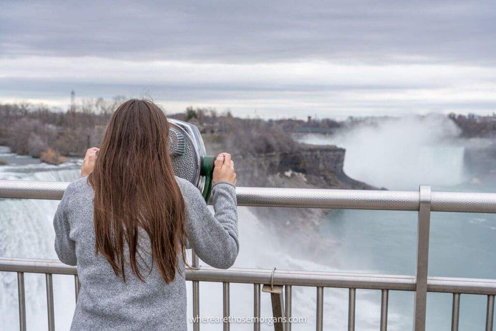 Woman looking through the viewfinder at Niagara Falls State Park