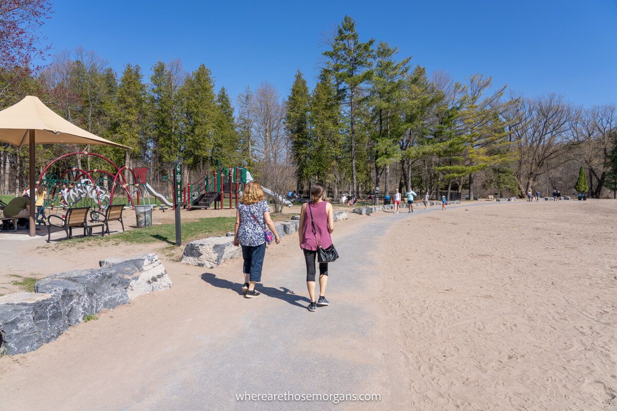 Two people walking around the Green Lake Round Lake loop trail