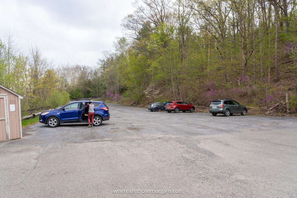 Woman getting into her SUV at the Buttermilk Falls main parking lot