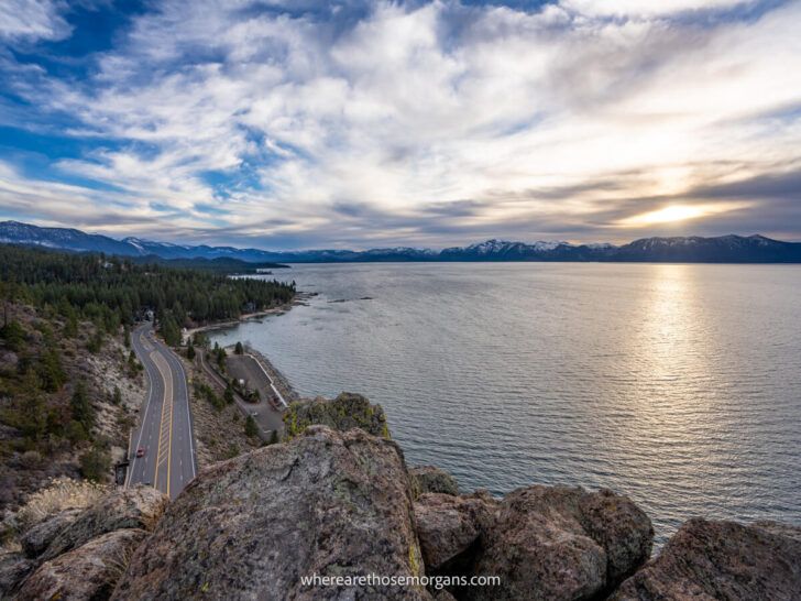Stunning sunset from the summit of Cave Rock Trail in Lake Tahoe NV as sunlight bursts through clouds