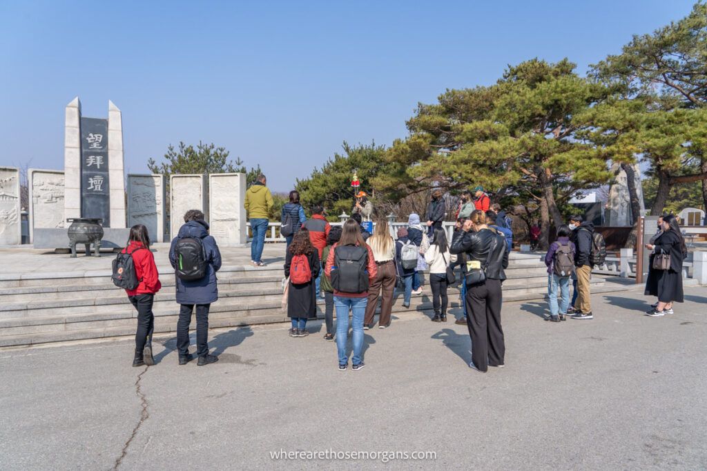 Visitors listening to a tour guide during a DMZ tour with Klook