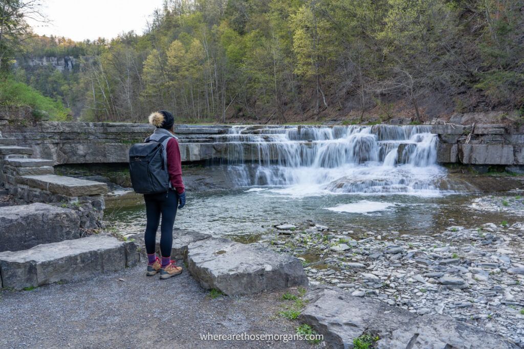 Hiker looking at lower Taughannock Falls near Ithaca New York