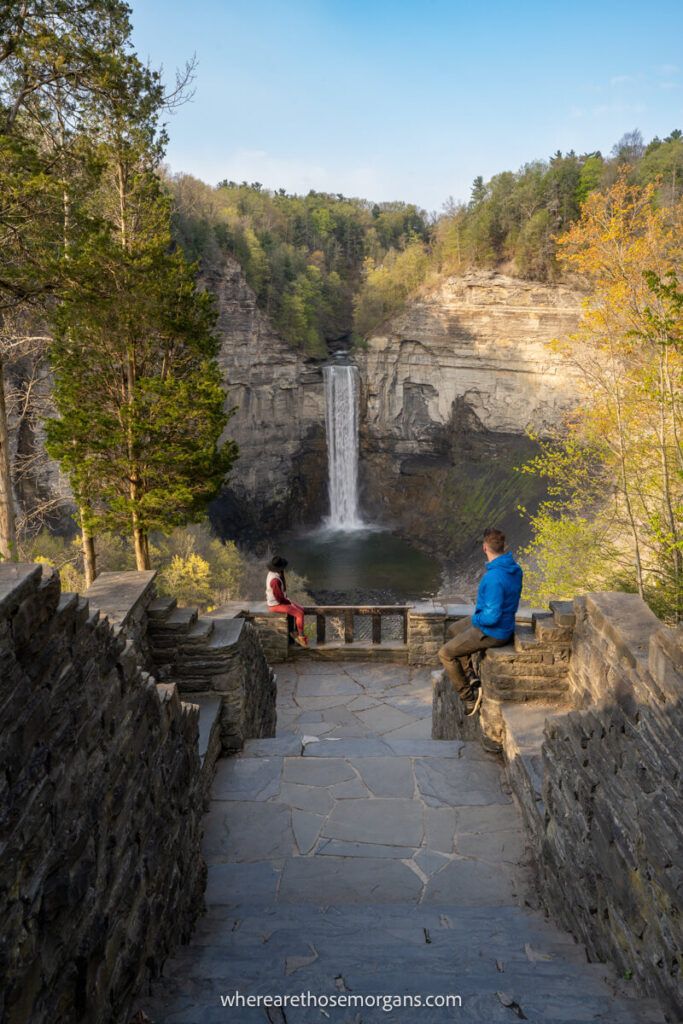 Two people looking down at Taughannock Falls from the popular Overlook