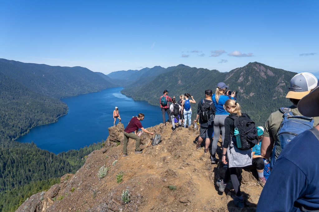 Many hikers crowded on top of Mount Storm King in Washington